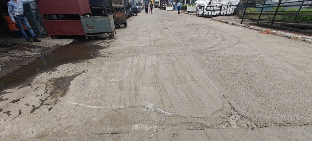 INDUSTRIAL ROAD- HEAVY VEHICLE CAUSING ABRASION AND POTHOLES